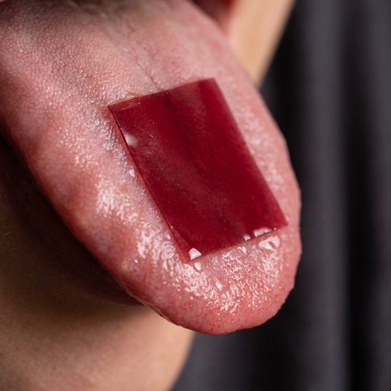 Energy Strips dissolving on the tongue