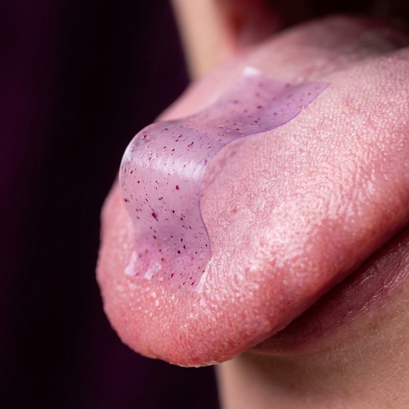 Probiotic + Metabolism Strips dissolving on the tongue